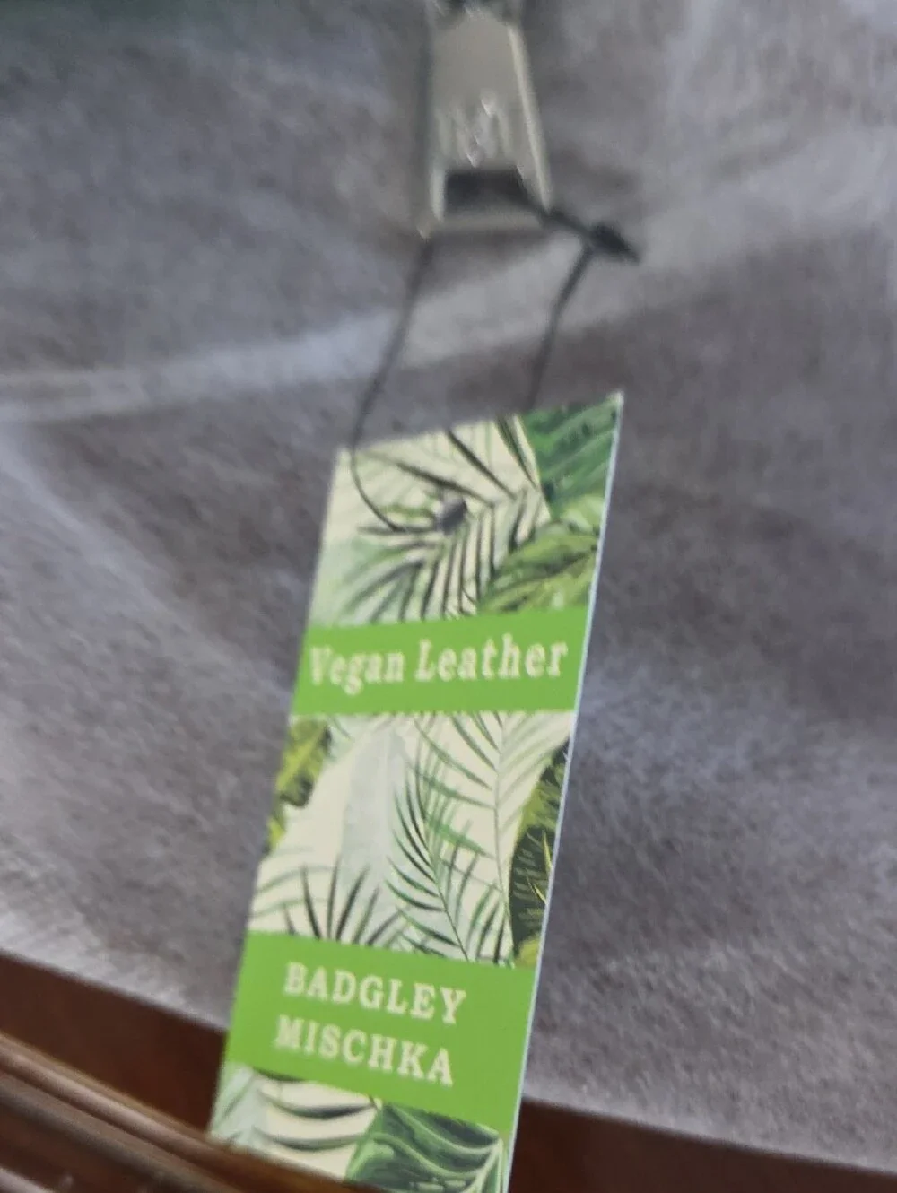 Badgley Mischka Green and White Vegan Leather Tag